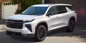 A 2025 Chevy Traverse backed into a driveway.