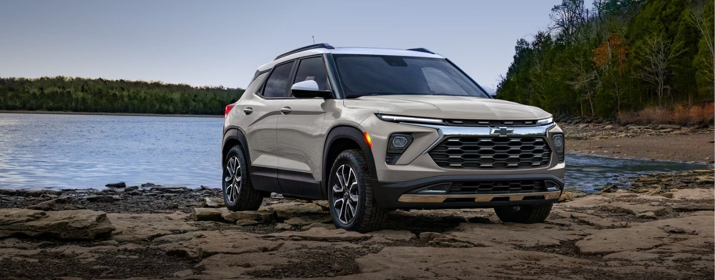 A sand-colored 2026 Chevy Trailblazer shown parked on a beach.