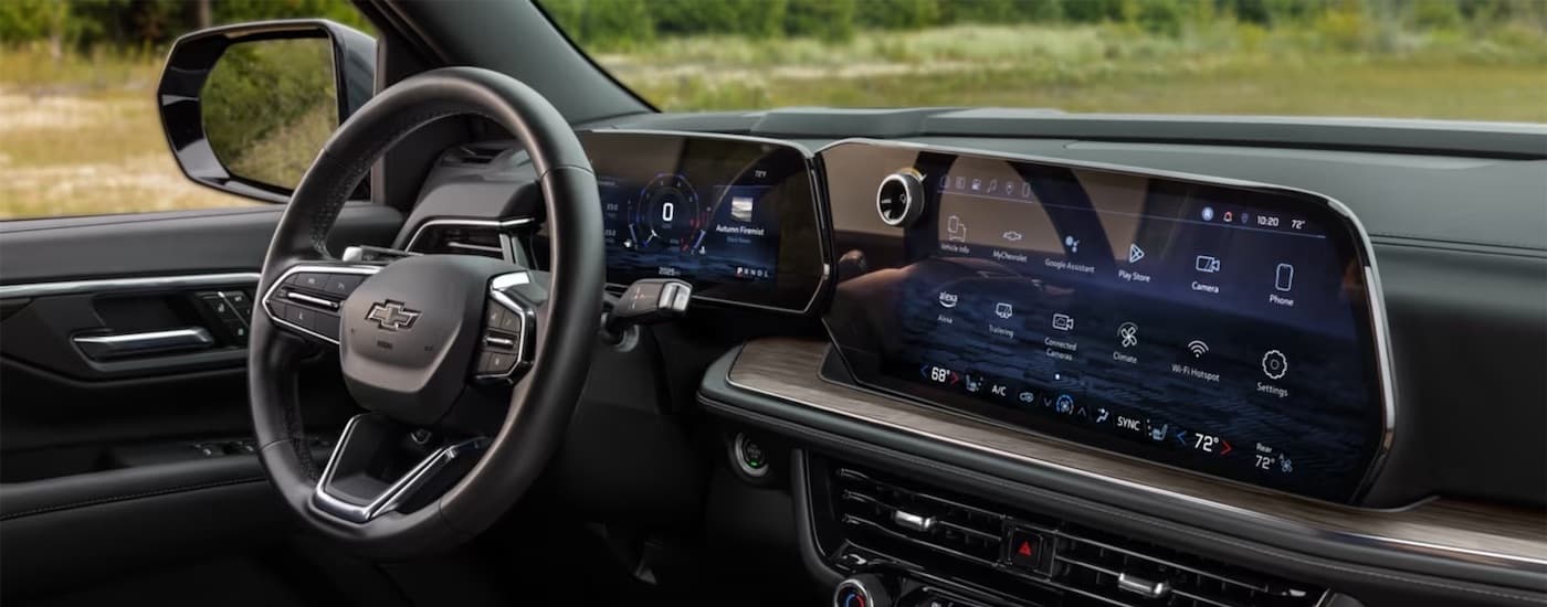 Steering wheel and dashboard in the interior of a 2026 Chevy Tahoe.