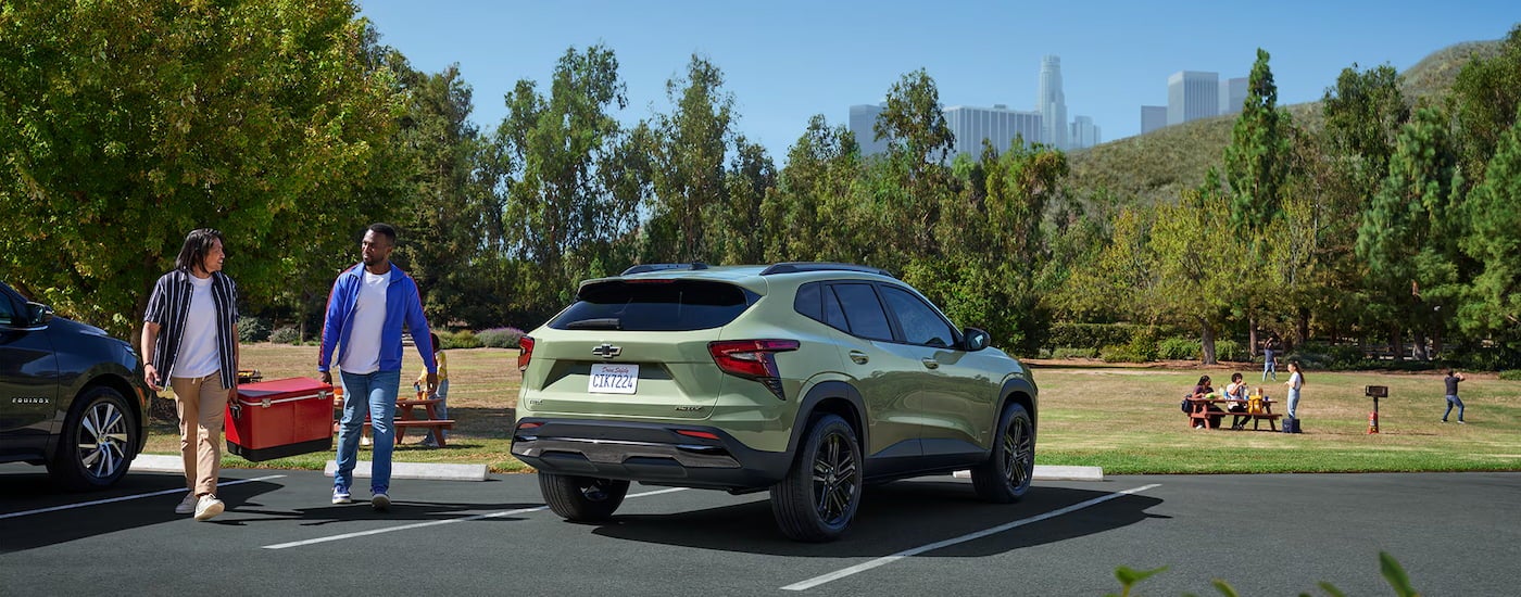 Rear of a green 2026 Chevy Trax ACTIV parked on a parking lot.