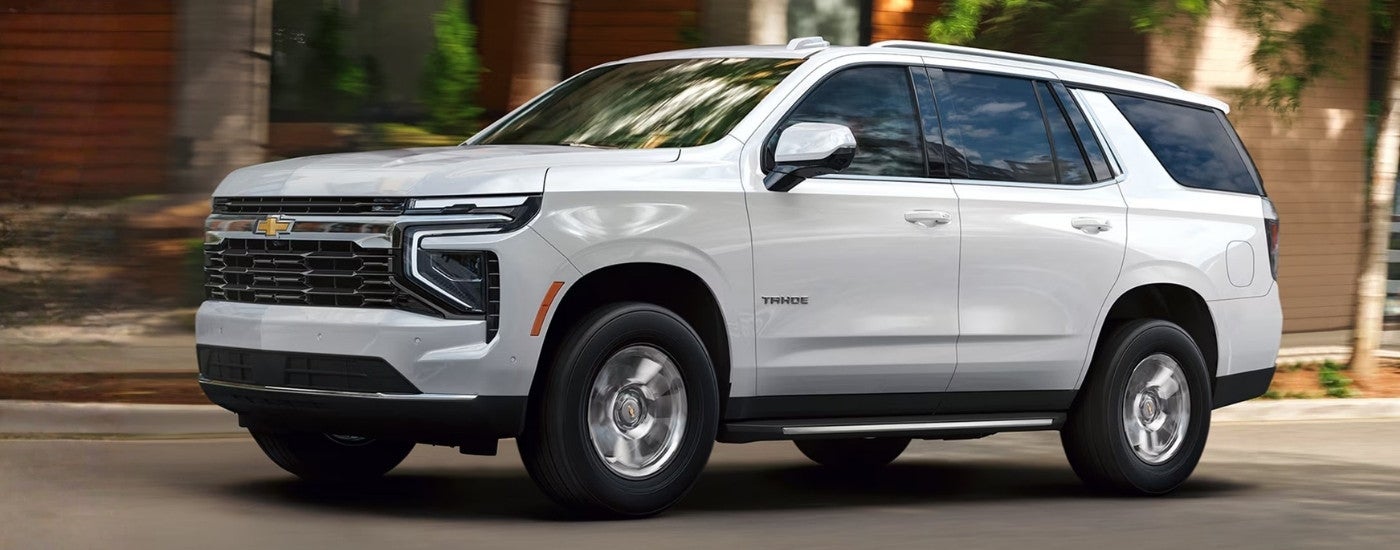White 2026 Chevy Tahoe driving on a city street