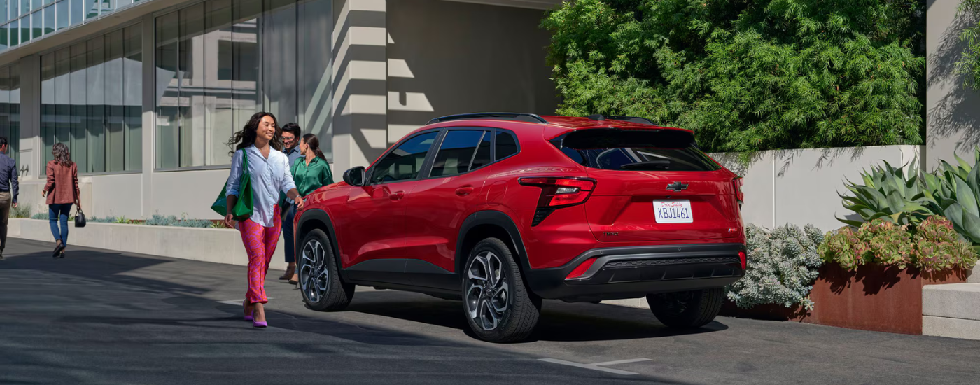 Red 2026 Chevy Trax parked on a city street