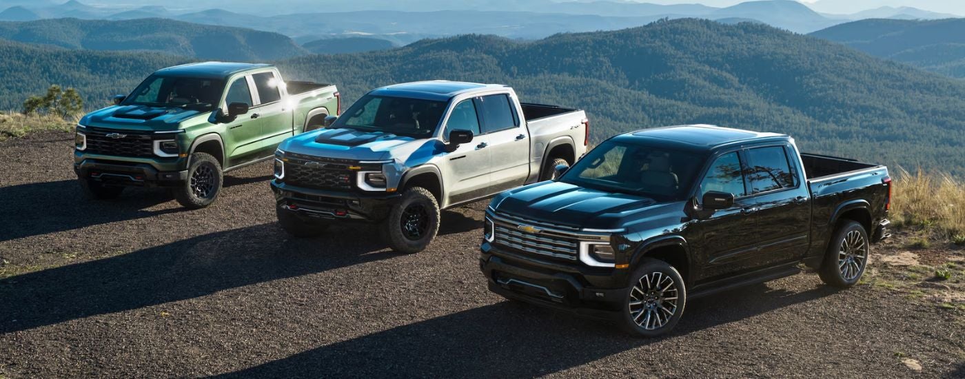 A 2027 Chevy Silverado 1500 green, white & black trio.