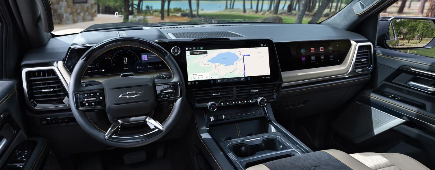 A 2027 Chevy Silverado 1500 black interior infotainment and steering.