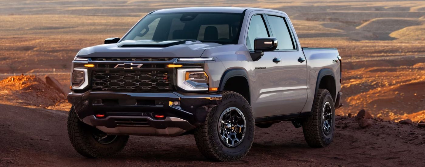 A white 2027 Chevy Silverado 1500 parked off road.